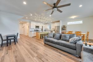 a living room with a couch and a kitchen at Lakefront Burlington Vacation Rental Dock and Beach in Twin Lakes