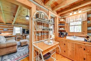 a kitchen and living room in a log cabin at Dobson Vacation Rental - Close to Wineries! in Dobson
