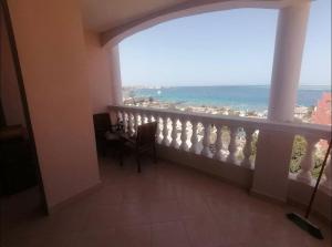 a balcony with a view of the ocean at kaltala in Hurghada