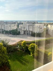 a view from a window of a building with a yard at شاليه في امواج amwaj in El Alamein
