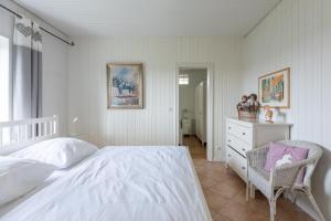 Postel nebo postele na pokoji v ubytování Haus am See