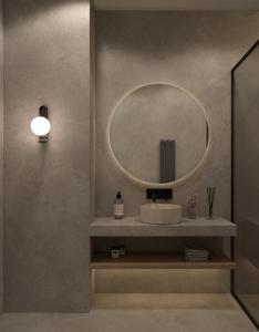 a bathroom with a sink and a mirror at Salamina's apartments in Salamina