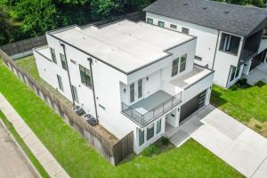 an aerial view of a large white house at Glam Paradise 5BRs Downtown Dallas in Dallas