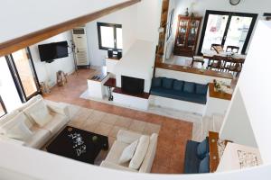 an overhead view of a living room with a couch at Kouvelia Country Home Luxury Villa Rental in Nerotriviá