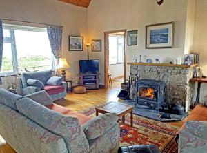Posezení v ubytování Lands End Cottage - Connemara