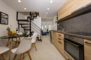 Η κουζίνα ή μικρή κουζίνα στο A&M Suite Apartment In Heraklion Center