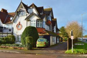 a yellow car parked in front of a house at Beautiful flat sleeps 4 in Taplow Maidenhead Near Windsor and Ascot racecourses Near Legoland in Taplow