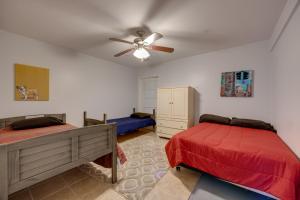 a bedroom with two beds and a ceiling fan at San Marcos Apartment on 10 Acres about 6 Mi to TSU! in San Marcos