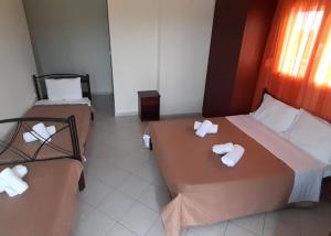 Postel nebo postele na pokoji v ubytování Hotel Kastri + 31 fotografií