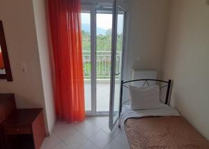 Postel nebo postele na pokoji v ubytování Hotel Kastri