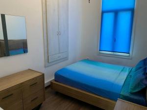 A bed or beds in a room at Blue Flag Award Winning Beach: Home 2