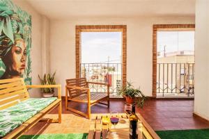 a living room with a couch and a table at Penthouse Duplex in a 5 floors typical spanish house-8 min to Center by Metro in Valencia