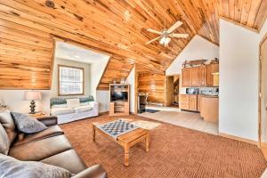 a living room with a couch and a table at Ski-InandSki-Out Ghent Cabin with Mountain Views! in Ghent