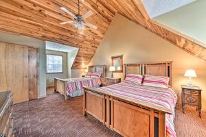 a bedroom with two beds and a wooden ceiling at Ski-In and Ski-Out Ghent Cabin with Mountain Views! in Ghent