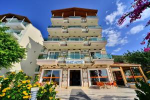 a building with balconies on the side of it at Kas Maki Hotel in Kas