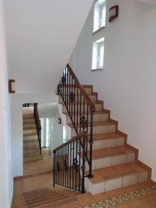 a staircase in a home with wooden floors at Willa Joanna in Kołobrzeg