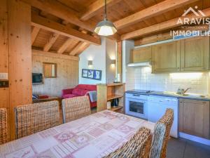 a kitchen and dining room with a table and chairs at Appartement Le Grand-Bornand, 4 pièces, 6 personnes - FR-1-391-98 in Le Grand-Bornand