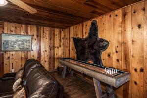 a living room with a bear on the wall at The Roost Downtown in Ruidoso