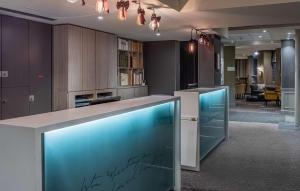 a kitchen with an aquarium in the middle of a room at Hotel Litteraire Le Swann, BW Premier Collection in Paris