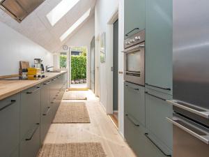 una cucina con armadi grigi e lucernario di 6 person holiday home in Hornslet a Hornslet
