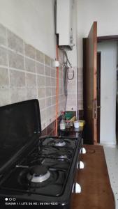 a kitchen with a stove top oven in a kitchen at شقة من غرفتين نوم وصالة in Tangier