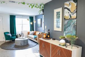 a living room with a couch and a table at Mystic Haven - Hot Tub, BBQ Grill, Beaches, Pet Friendly in Largo