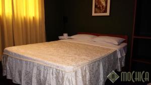 Letto o letti in una camera di Hostal Residencial Mochica