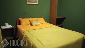 Letto o letti in una camera di Hostal Residencial Mochica