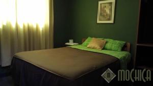 Letto o letti in una camera di Hostal Residencial Mochica