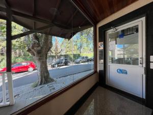 a room with a window with a view of a street at Hotel Solar da Montanha in Campos do Jordão