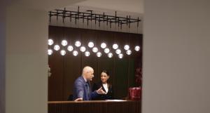 a man and a woman standing in front of a counter at Casabianca Resort in Fondi