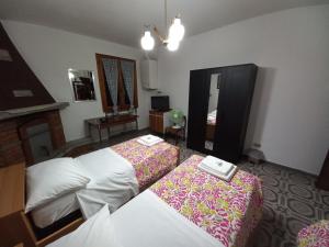 A bed or beds in a room at Appartamento Degli Dei (Affittacamere)