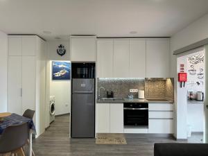 Η κουζίνα ή μικρή κουζίνα στο Paradise Apartments II
