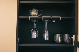 a shelf with wine glasses and a teapot at ambit - Vacation STAY 99416v in Kami Amakusa