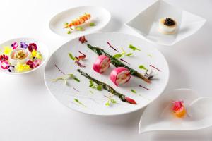 a group of plates of food on a table at ANA InterContinental Tokyo, an IHG Hotel in Tokyo