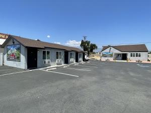 a parking lot in front of a building at Fontana Inn in Fontana