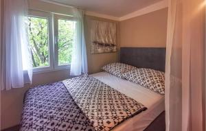 Ein Bett oder Betten in einem Zimmer der Unterkunft Amazing Apartment In Rijeka With Kitchen