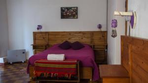 En eller flere senger på et rom på finca el Rincón