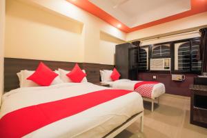 Posteľ alebo postele v izbe v ubytovaní Flagship Near Redikuppam Main Road Near Juhu Beach