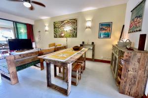 Vaiava Beach Carlton- Tahiti - beachfront luxury residence & pool - 4 pers的电视和/或娱乐中心