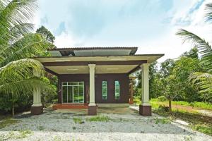 a small house with a roof at Casaria Homestay Besut in Jertih