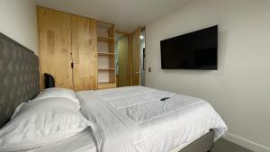 TV a/nebo společenská místnost v ubytování Edificio Helena