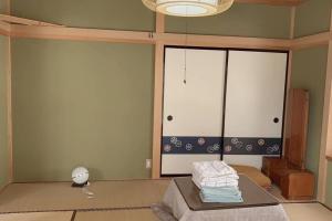Voodi või voodid majutusasutuse 一番館※温泉街に近く、心が落ち着く別荘地同樺順荘 toas