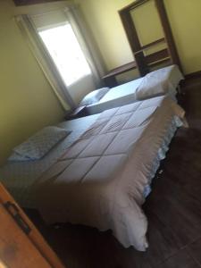 Ein Bett oder Betten in einem Zimmer der Unterkunft RECANTO NA MATA