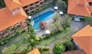 an aerial view of a resort with a swimming pool at Adi Dharma Hotel Kuta in Kuta