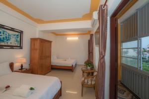 Llit o llits en una habitació de Thinh Phuc Homestay