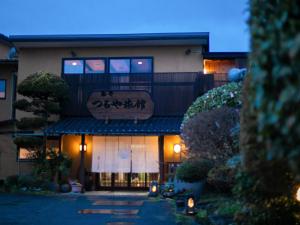 a building with a sign on the front of it at Tsuruya / Vacation STAY 59065 in Miyaji