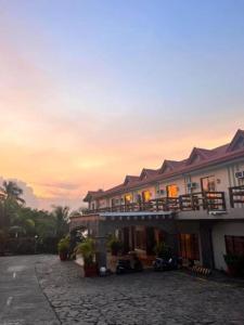 a building with motorcycles parked in front of it at La Virginia Leisure Park and Amusement powered by Cocotel in Mataasnakahoy