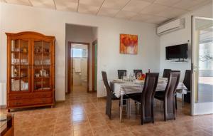 a dining room with a table and chairs at Nice Home In Baena With Outdoor Swimming Pool in Baena