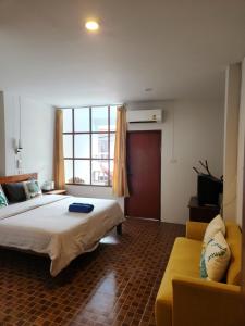 מיטה או מיטות בחדר ב-Petit Suncliff Resort